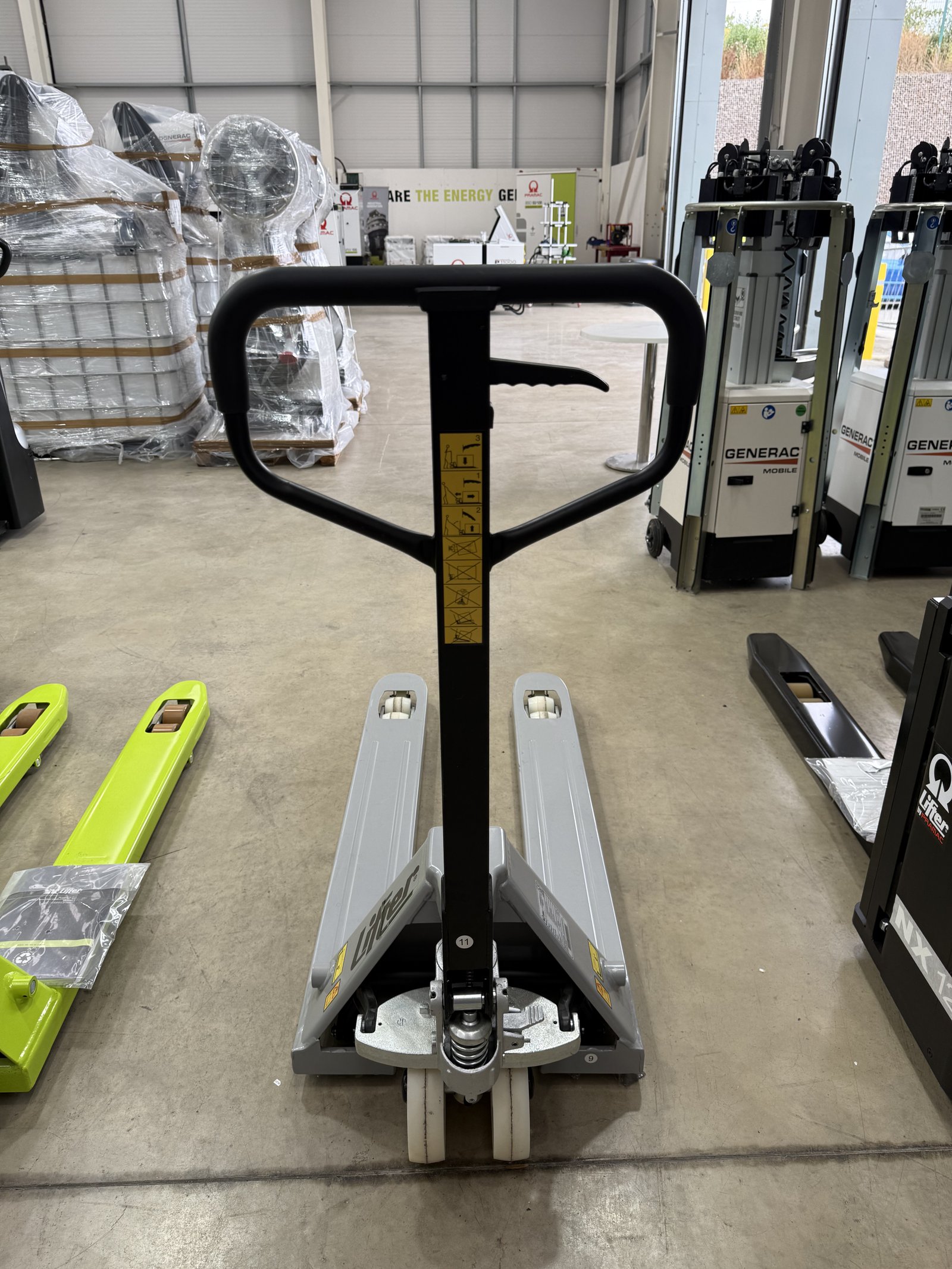 Manual warehouse pallet truck with long forks